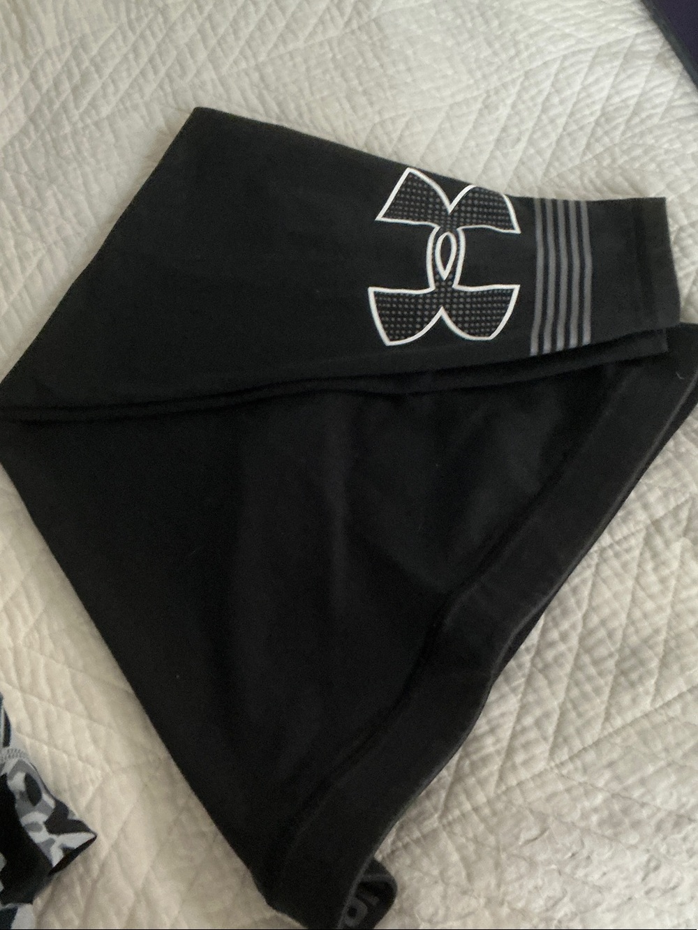 Under Armour Black Women’s athletic 3/4 leggings designed for active wear.